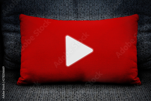The symbol begins with a white triangle on a red pillow placed on the sofa, concepts, communication and technology.