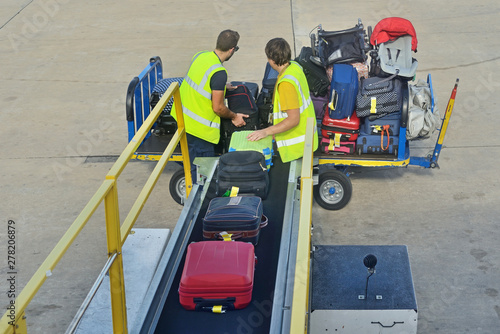 Loading luggage to the plane.