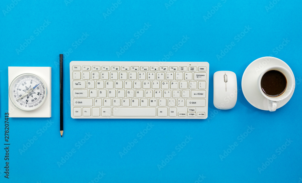 Top view of Office desk table of Business workplace and business objects on blue background Top view of Office desk table of Business workplace and business objects on blue background
