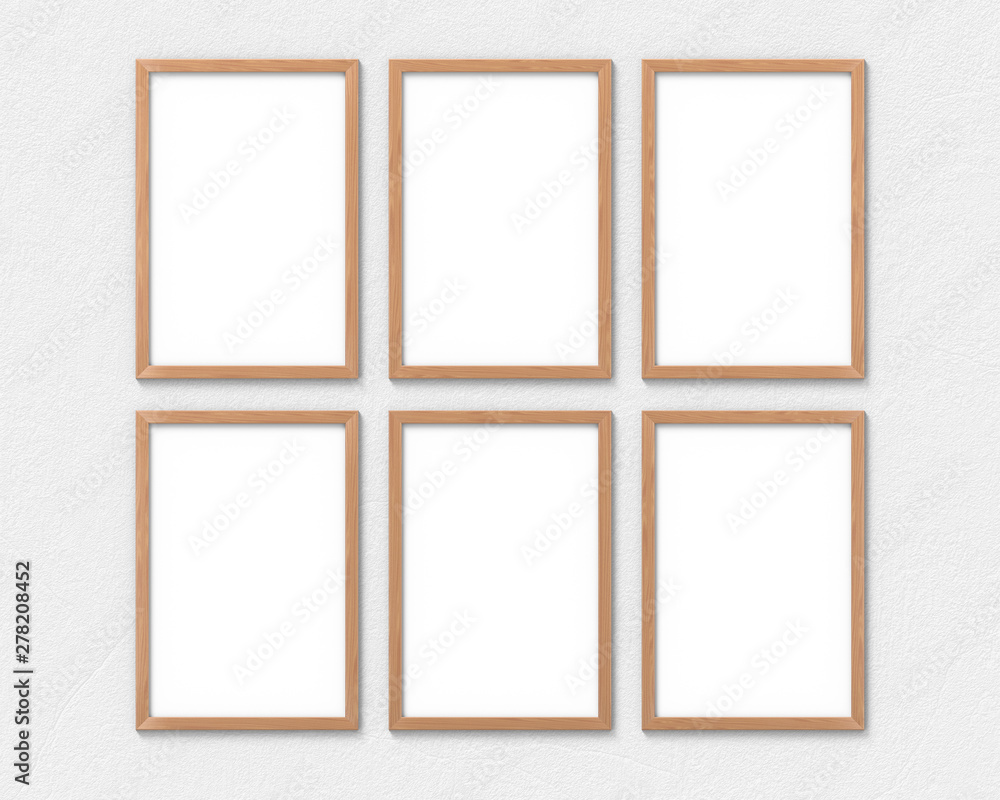 Set of 6 vertical wooden frames mockup with a border hanging on the wall. Empty base for picture or text. 3D rendering. Set of 6 vertical wooden frames mockup with a border hanging on the wall. Empty base for picture or text. 3D rendering.