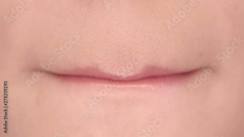 Lips of a beautiful girl close up