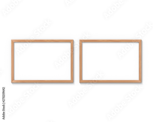 Set of 2 horizontal wooden frames mockup hanging on the wall. Empty base for picture or text. 3D rendering.