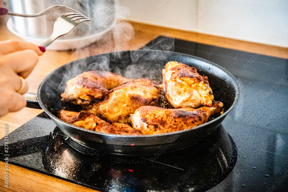 Fried chicken legs in pan 