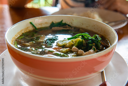 Thai spicy mixed vegetable soup or Kang Liang in the bowl photo