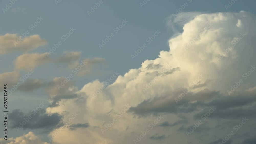 Time interval. Clouds are floating against the blue sky. The wind drives clouds across the sky Time interval. Clouds are floating against the blue sky. The wind drives clouds across the sky