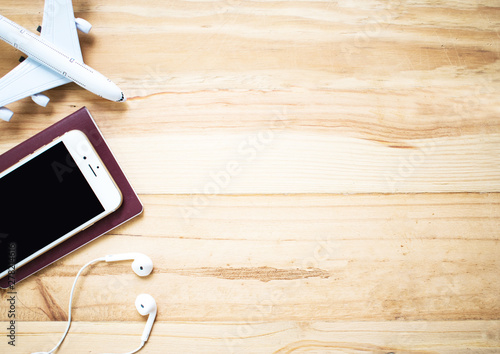 Outfit of traveler on an old wooden table with copy space on the right, Travel concept