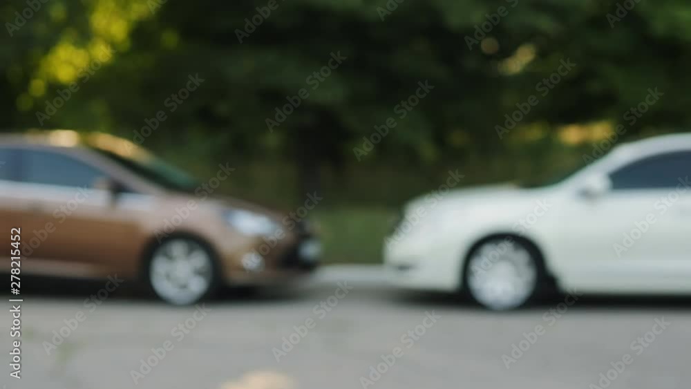 Man gives a car key to the other man Man gives a car key to the other man