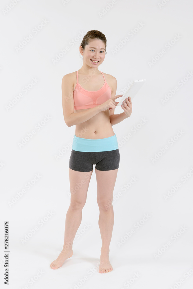 タブレットを持ったスタイルの良い女性 Stock Photo Adobe Stock タブレットを持ったスタイルの良い女性 Stock Photo Adobe Stock