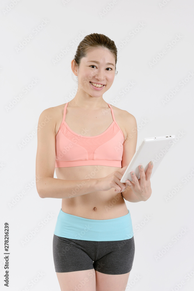 タブレットを持つスタイルの良い女性 Stock Photo Adobe Stock タブレットを持つスタイルの良い女性 Stock Photo Adobe Stock
