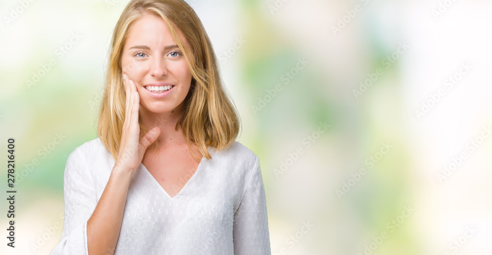 Beautiful young elegant woman over isolated background touching mouth with hand with painful expression because of toothache or dental illness on teeth. Dentist concept. Beautiful young elegant woman over isolated background touching mouth with hand with painful expression because of toothache or dental illness on teeth. Dentist concept.