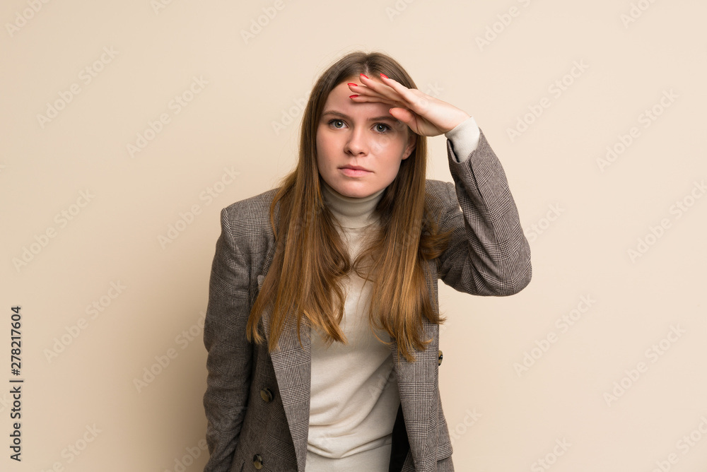 Young business woman looking far away with hand to look something Young business woman looking far away with hand to look something