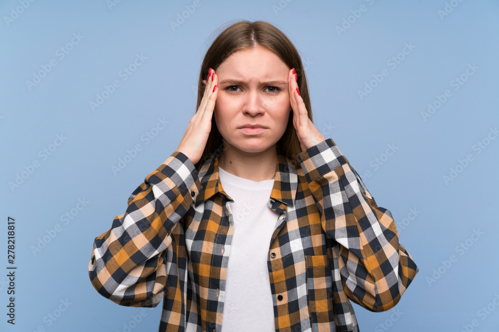 Young woman over blue wall unhappy and frustrated with something. Negative facial expression Young woman over blue wall unhappy and frustrated with something. Negative facial expression