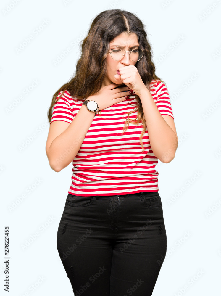 Young beautiful woman wearing glasses feeling unwell and coughing as symptom for cold or bronchitis. Healthcare concept. Young beautiful woman wearing glasses feeling unwell and coughing as symptom for cold or bronchitis. Healthcare concept.