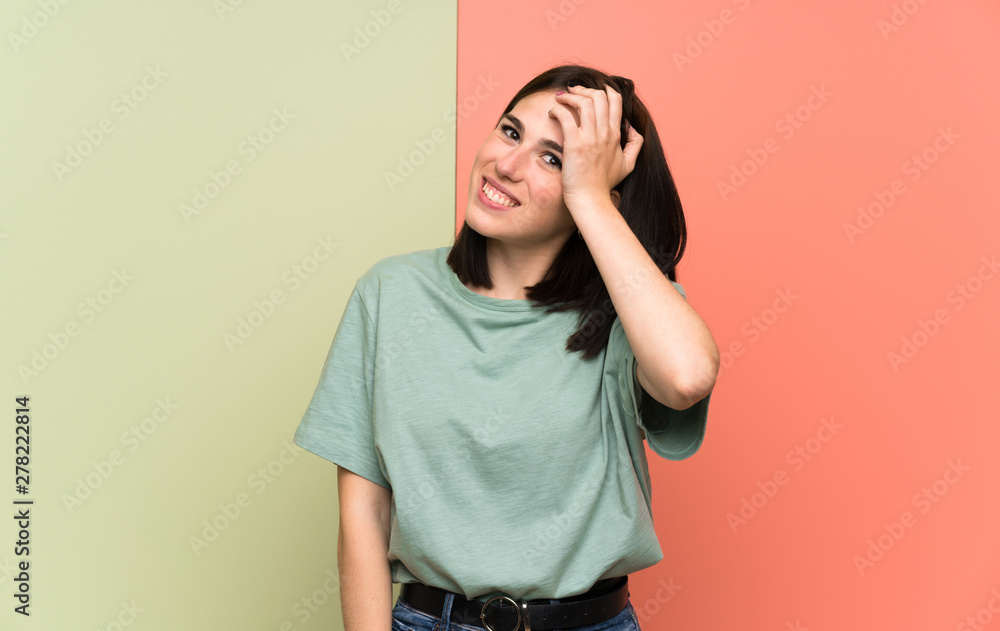 Young woman over isolated colorful wall laughing Young woman over isolated colorful wall laughing