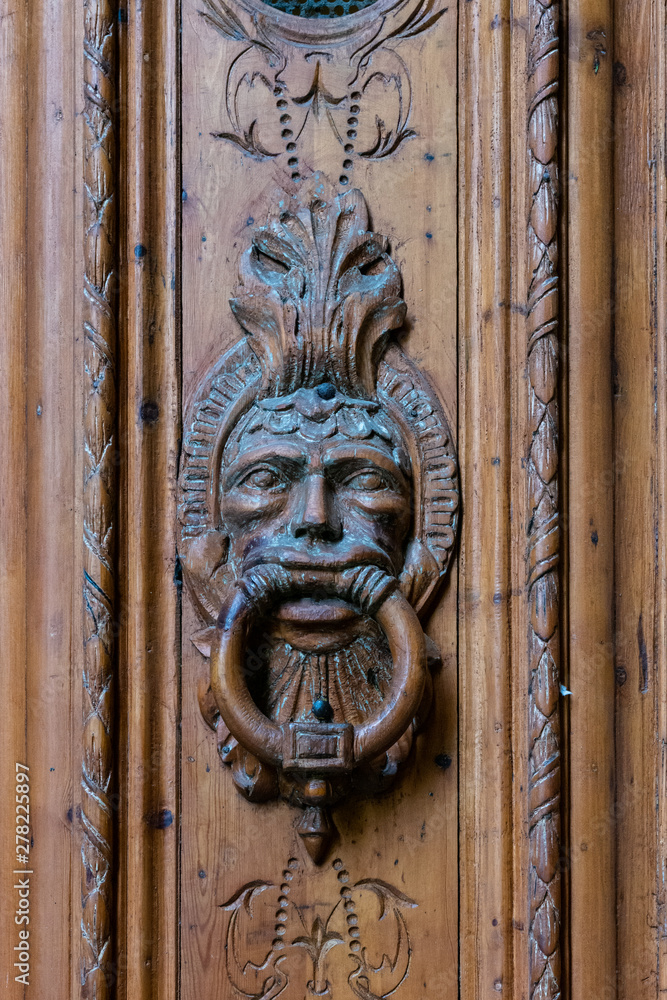 Wooden door knocker. Barri Gotic. Barcelona.