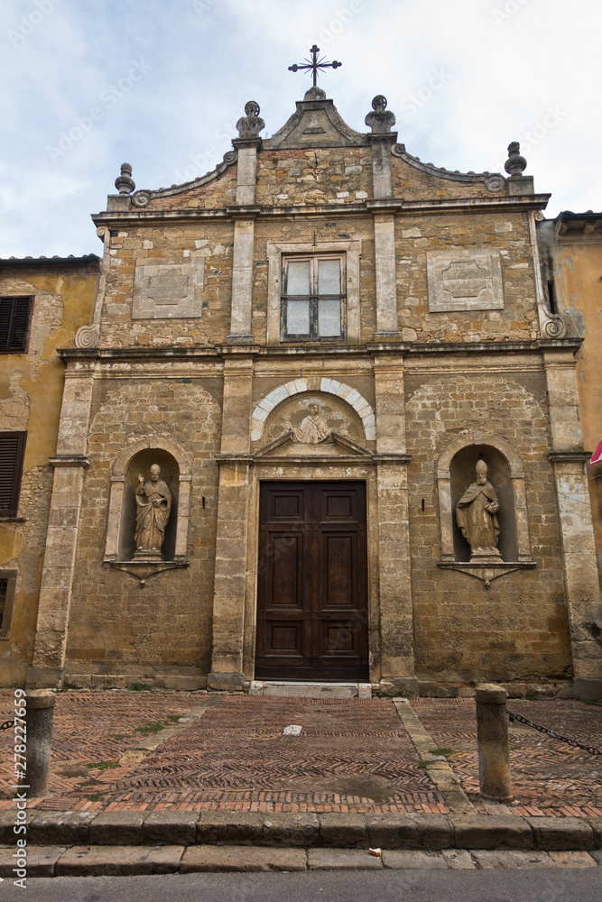 Entrance to small church chiesa di San Pietro in Selci near Fortezza Medicea in Voltera, Tuscany, Italy
