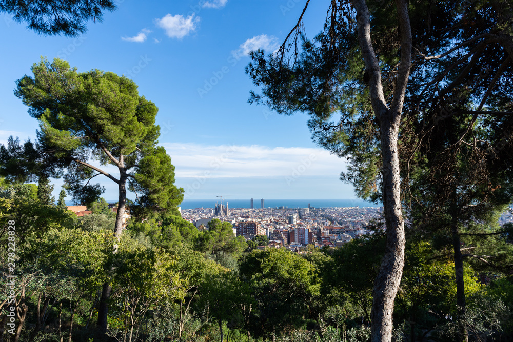 View of the roofs of Barcelona from Parc Guell terrace. Barcelona.
