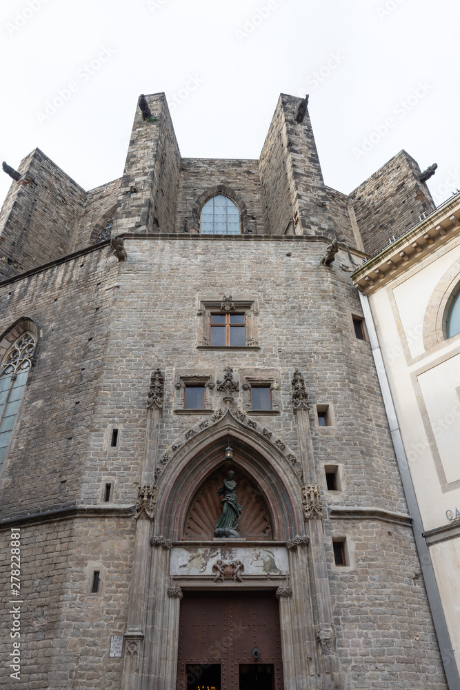 Basilica de Santa Maria del Mar, detail of the secondary entrance in tipical Catalan Gothic, Barcelona. Spain.