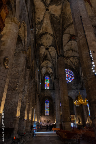 Detail of a lateral nave inside Basilica Santa Maria del Mar with colourful glass windows of the main facade. Barcelona.