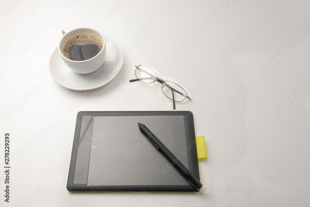 black coffee and plate and writing paddle on white background with copy space black coffee and plate and writing paddle on white background with copy space