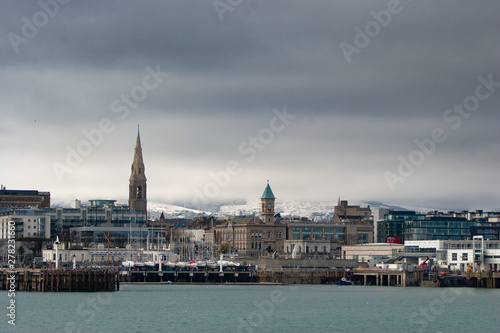Snow Dun Laoghaire town with snowed hills in background © Sebastian