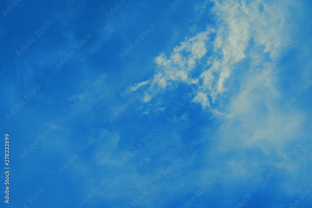 Fototapeta premium Blue sky background with small clouds