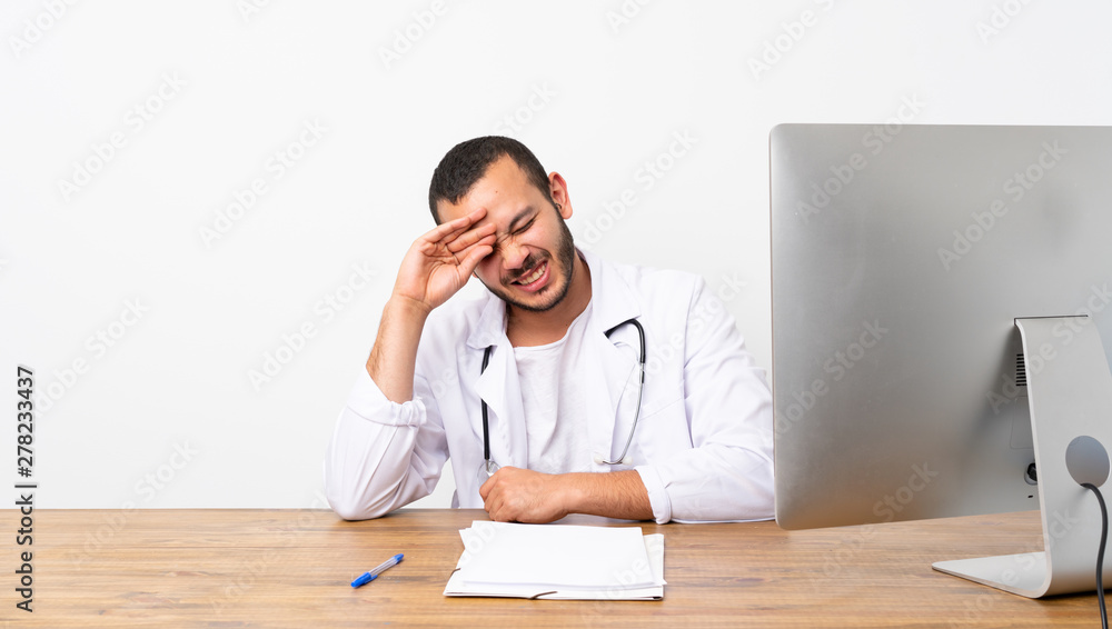 Doctor Colombian man with tired and sick expression Doctor Colombian man with tired and sick expression