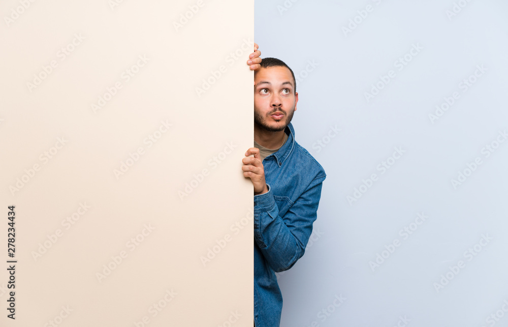 Colombian man holding an empty placard Colombian man holding an empty placard