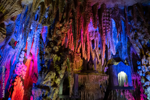 Nice cave with stone pattern formed by nature, stalactites, stalagmites, karst limestone © Pavel