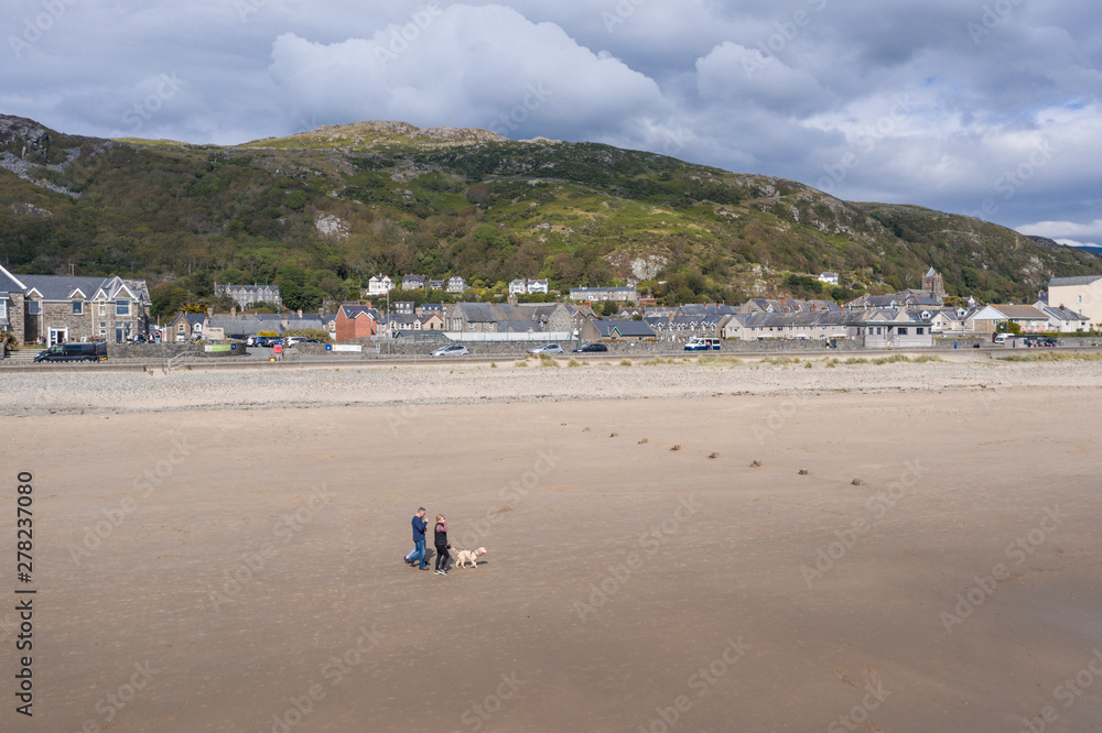 Sandy Beach of Historic Coastal Town in North Wales, UK Sandy Beach of Historic Coastal Town in North Wales, UK