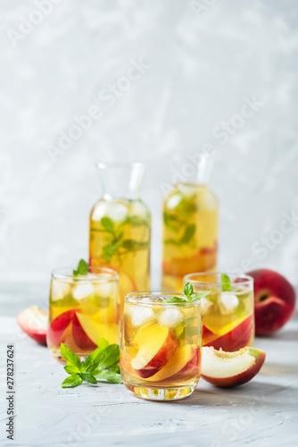 Summer cold tea with peaches and mint