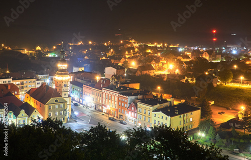 A bird's eye view of the town hall and marketplace during a night in the city of Otmuchow. photo