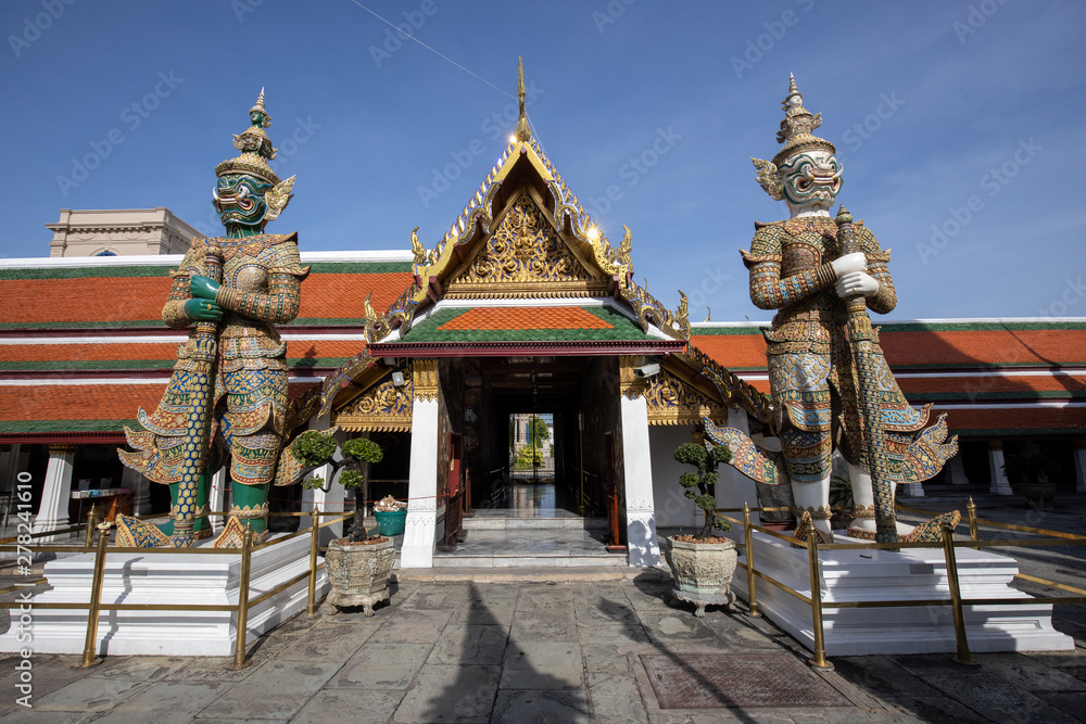 Giant Demon Guardian Standing in  Front of Wat Phra Kaew (Grand Palace) Door in Bangkok Thailand