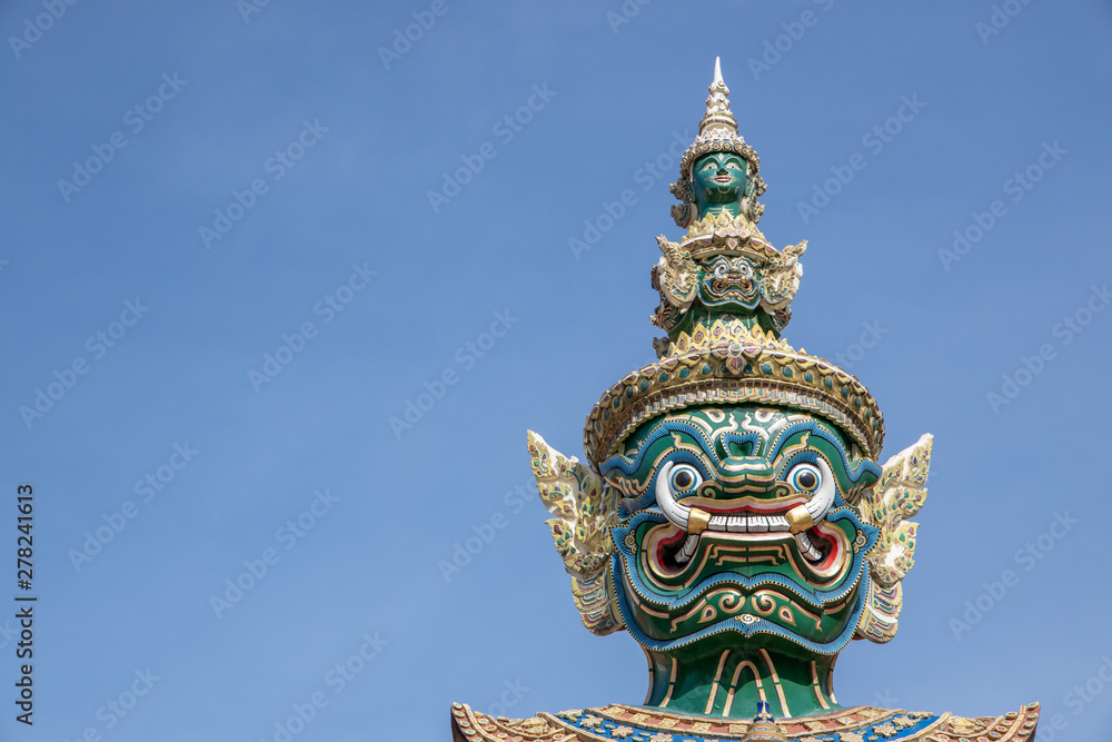 Giant Demon Guardian Standing in  Front of Wat Phra Kaew (Grand Palace) Door in Bangkok Thailand