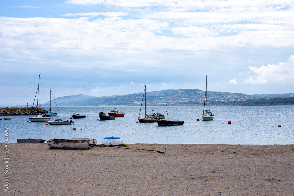 The harbour in Rhos-on-Sea with Colwyn Bay in distance, Conwy, North Wales UK