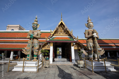 Giant Demon Guardian Standing in  Front of Wat Phra Kaew (Grand Palace) Door in Bangkok Thailand © charnsitr