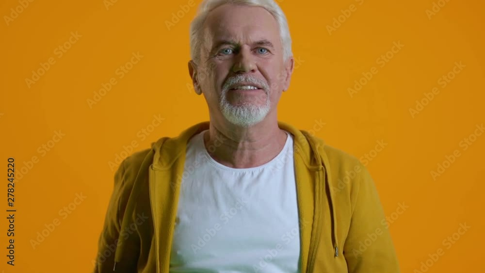 Excited retired male playing video game by joystick, modern technology, hobby Excited retired male playing video game by joystick, modern technology, hobby
