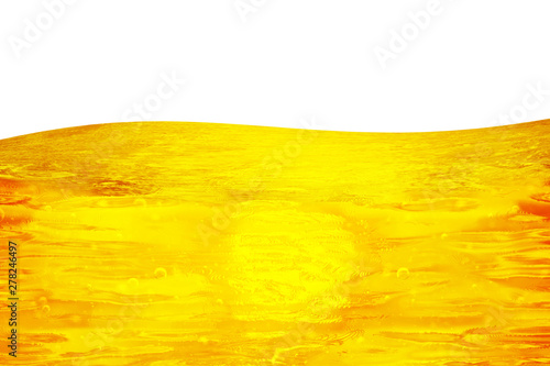 Oil background. Liquid flows yellow, for the project, oil, honey, beer or other variants on white background, area for text