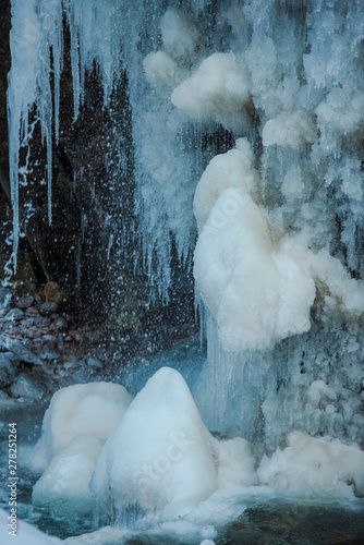 Icicles on the rocks in cold winter