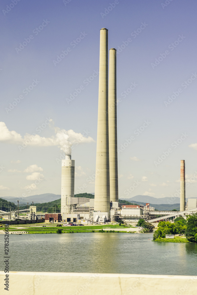 Tall Stacks of a Coal Power Plant by a River