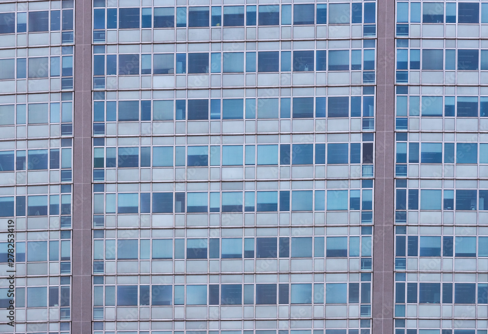 Background of the windows and balconies of the multi-storey building.