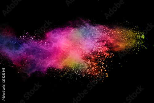 abstract colored dust explosion on a black background.abstract powder splatted background,Freeze motion of color powder exploding/throwing color powder, multicolored glitter texture. © kitsana