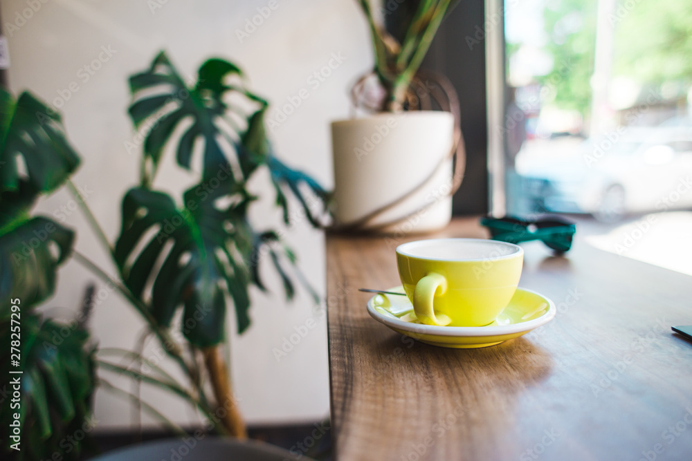 Cappuccino in a yellow cup. Cappuccino in a yellow cup.