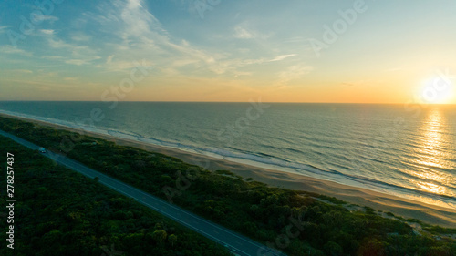 Sunrise over the beach and road