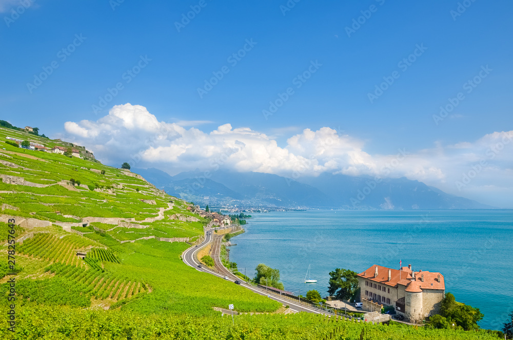 Stunning view of Geneva Lake, Switzerland with beautiful terraced vineyards on slopes by the lake. Swiss Lac Leman is popular tourist destination. Amazing nature. Scenery, Europe, travel