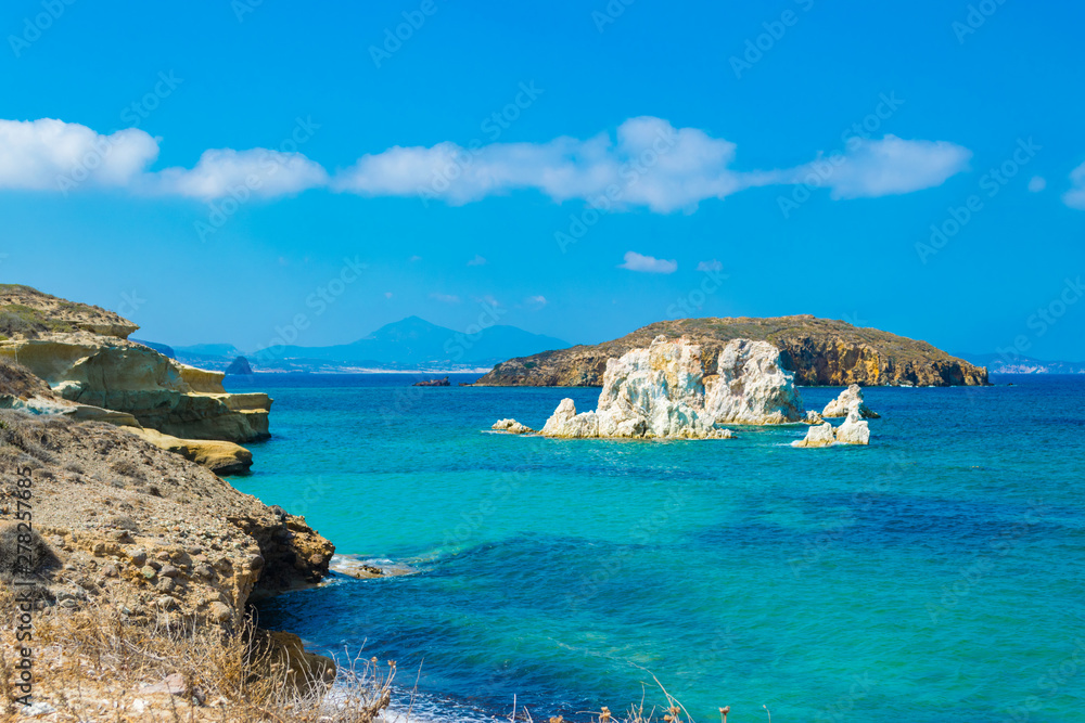 Fototapeta premium Ellinika beach with turquoise crystal waters in Kimolos island, Cyclades, Greece