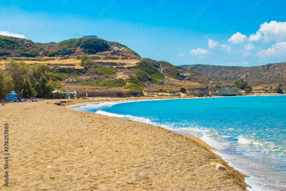 Ellinika beach with turquoise crystal waters in Kimolos island, Cyclades, Greece. Free camping at the beach