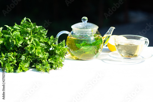 Refreshing mint tea on a sunny summer morning. Healthy breakfast.