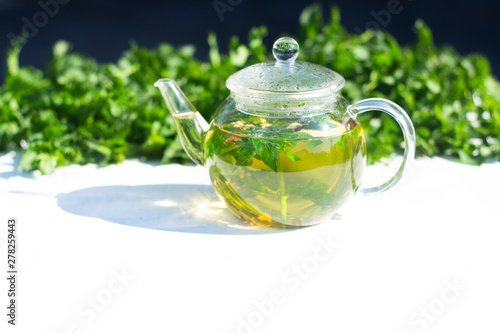Refreshing mint tea on a sunny summer morning. Healthy breakfast.
