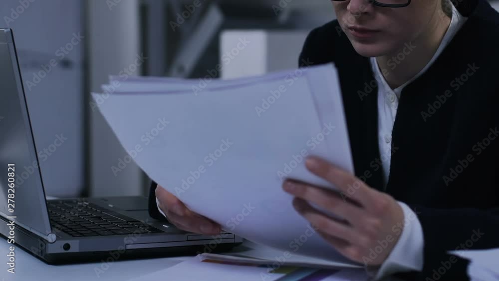Businesswoman doing paperwork in office, checking financial statements, closeup Businesswoman doing paperwork in office, checking financial statements, closeup